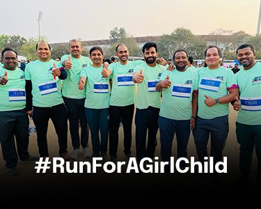 Vertex team celebrating completion of Run for a Girl Child marathon with hashtag RunForAGirlChild commitment to girls' education