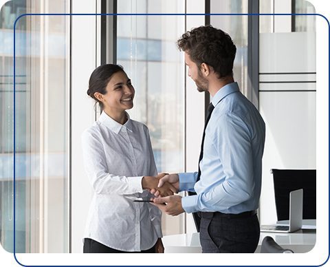 IT staffing consultant and hiring manager shaking hands during a contract talent placement meeting