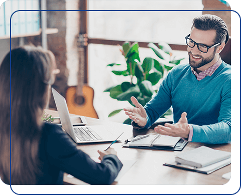 IT professional discussing contract job opportunities with a recruiter in a casual office setting