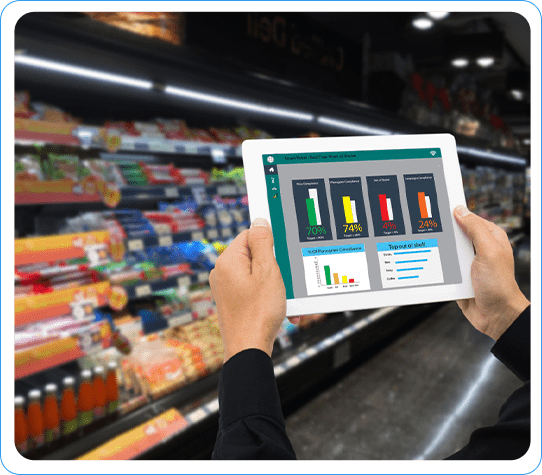 Hands holding a tablet displaying planogram data with charts and graphs in a grocery store aisle.