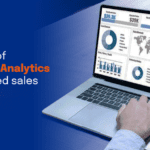The power of Salesforce Analytics for enhanced sales insights, with a sales dashboard on a laptop screen