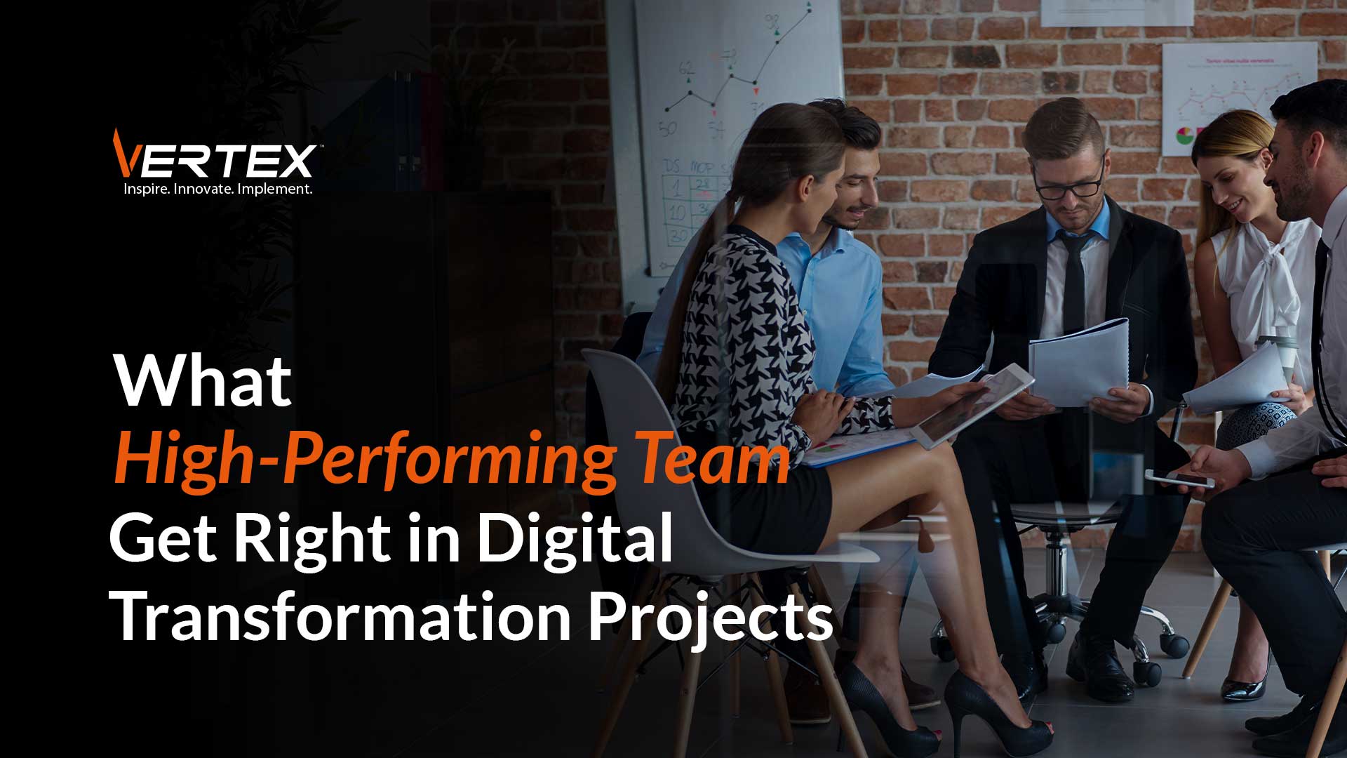 High-performing team reviewing documents and collaborating on a digital transformation project in a modern office